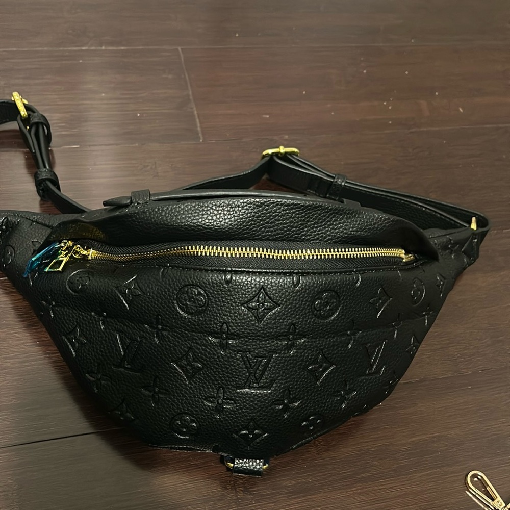 All black Fanny pack with LV all around the bag.